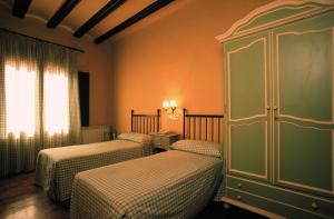 Posteľ alebo postele v izbe v ubytovaní Posada del Almudí
