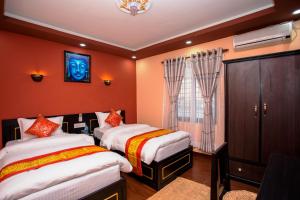 Voodi või voodid majutusasutuse Gurung's Home toas