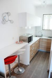 Kuchyňa alebo kuchynka v ubytovaní Paradis Apartments