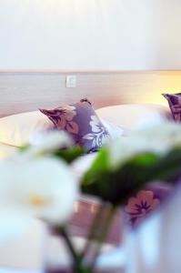 Posteľ alebo postele v izbe v ubytovaní Paradis Apartments