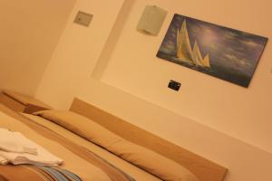 A bed or beds in a room at Hotel Europa