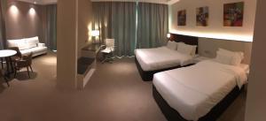 Higher Hotel客房内的一张或多张床位