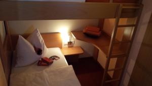 מיטה או מיטות בחדר ב-Appartements Fritz Sagmeister