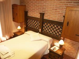 Voodi või voodid majutusasutuse Hotel Rural El Rocal toas