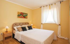 Postel nebo postele na pokoji v ubytování Apartman Čižići 97 a