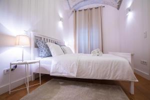 Posteľ alebo postele v izbe v ubytovaní Deluxe Apartment Talia