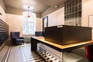 a large table in a room with two chairs at Orange Apartments Mere in Tallinn +19 photos