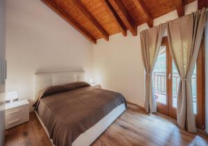 A bed or beds in a room at Residenza Finestra sul Parco
