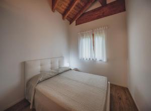 A bed or beds in a room at Residenza Finestra sul Parco