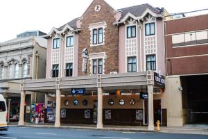 a building on the corner of a street at Tudor House Hotel in Durban