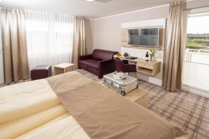 TV a/nebo společenská místnost v ubytování Hotel Tiek Superior