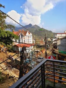 a view of a city from a balcony at Thanh Ha Homestay Sapa in Sa Pa