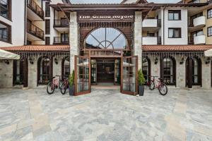 a group of bikes parked in front of a building at Grand Royale Apartment Complex & Spa in Bansko