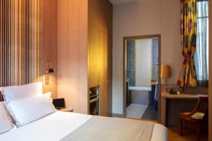Кровать или кровати в номере Hôtel Regent's Garden - Astotel