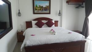 Postel nebo postele na pokoji v ubytování Bonsai Villa Hoi An