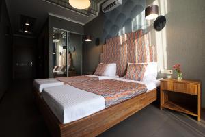 Säng eller sängar i ett rum på Мини-Отель "Навруз"