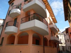 a building with balconies on the side of it at Residence Gloria in Grado