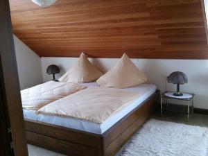 Ένα ή περισσότερα κρεβάτια σε δωμάτιο στο Ferienhaus Raabe