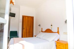 Posteľ alebo postele v izbe v ubytovaní Hotel Iberico