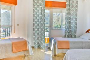Posteľ alebo postele v izbe v ubytovaní Hotel Iberico + 25 fotografií