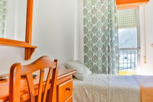 Posteľ alebo postele v izbe v ubytovaní Hotel Iberico