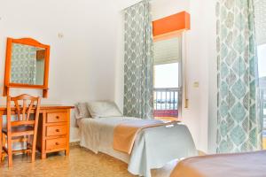 Posteľ alebo postele v izbe v ubytovaní Hotel Iberico