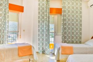 Posteľ alebo postele v izbe v ubytovaní Hotel Iberico