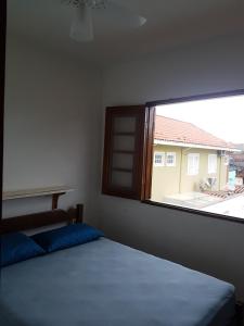 Postel nebo postele na pokoji v ubytování Sol e Cia casa de temporada