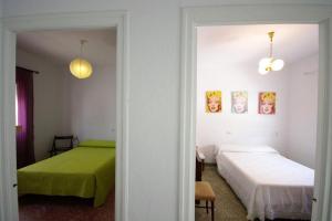 Postel nebo postele na pokoji v ubytování Casa Lepanto