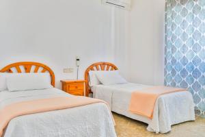 Posteľ alebo postele v izbe v ubytovaní Hotel Iberico