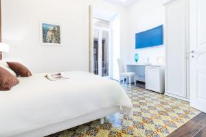 Postel nebo postele na pokoji v ubytování Suites Sorrento Elegance