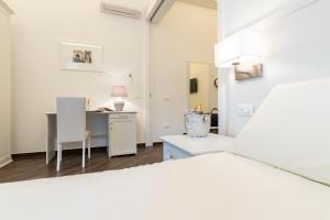Postel nebo postele na pokoji v ubytování Suites Sorrento Elegance