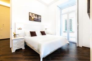 Postel nebo postele na pokoji v ubytování Suites Sorrento Elegance