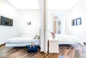 Postel nebo postele na pokoji v ubytování Suites Sorrento Elegance