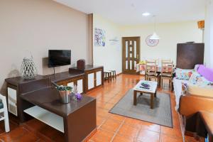 a living room with a couch and a table at Marody House Vacacional in Granadilla de Abona