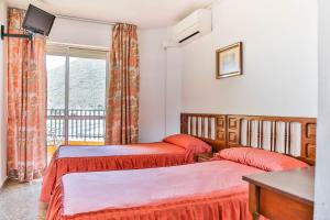 Posteľ alebo postele v izbe v ubytovaní Hotel Iberico