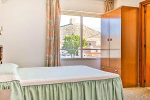 Posteľ alebo postele v izbe v ubytovaní Hotel Iberico