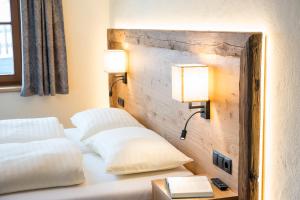 Łóżko lub łóżka w pokoju w obiekcie Aparthotel Weningeralm