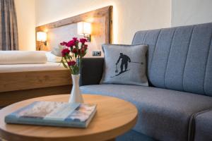 Łóżko lub łóżka w pokoju w obiekcie Aparthotel Weningeralm