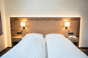 Łóżko lub łóżka w pokoju w obiekcie Aparthotel Weningeralm