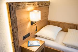 Łóżko lub łóżka w pokoju w obiekcie Aparthotel Weningeralm