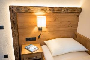 Łóżko lub łóżka w pokoju w obiekcie Aparthotel Weningeralm