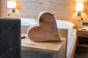 Łóżko lub łóżka w pokoju w obiekcie Aparthotel Weningeralm