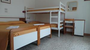 Postel nebo postele na pokoji v ubytování Hotel Graziana