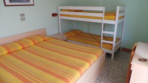 Postel nebo postele na pokoji v ubytování Hotel Graziana