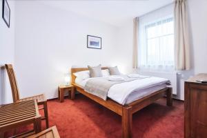 Postel nebo postele na pokoji v ubytování Penzion Al Capone Mníšek