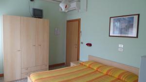 Postel nebo postele na pokoji v ubytování Hotel Graziana