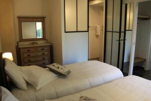 Letto o letti in una camera di Logies Tommenmolen