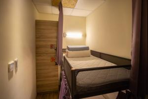 Postel nebo postele na pokoji v ubytování Hostel Jiizu