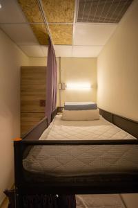 Postel nebo postele na pokoji v ubytování Hostel Jiizu